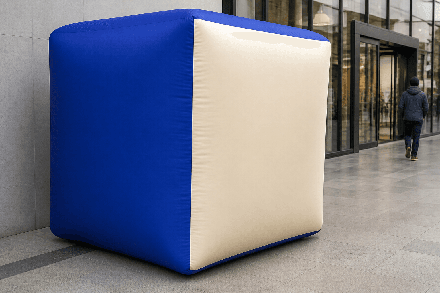 Cobalt blue and cream inflatable package box replica at a retail entrance