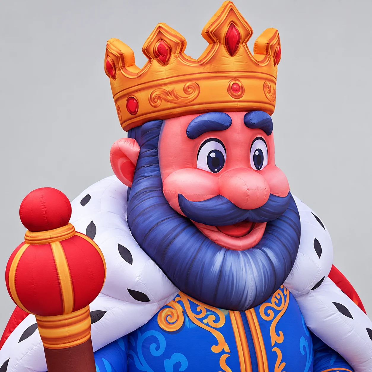 King mascot crown, expressive face and purple-blue beard detail