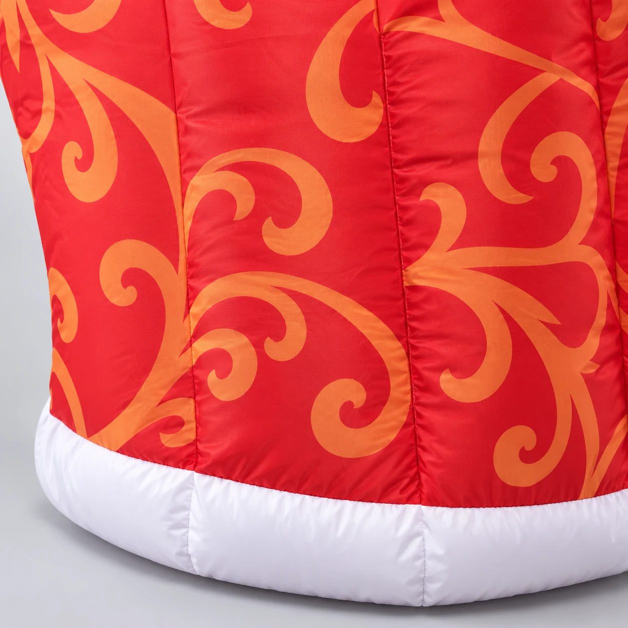 Patterned red king cape with white and black-spotted trim
