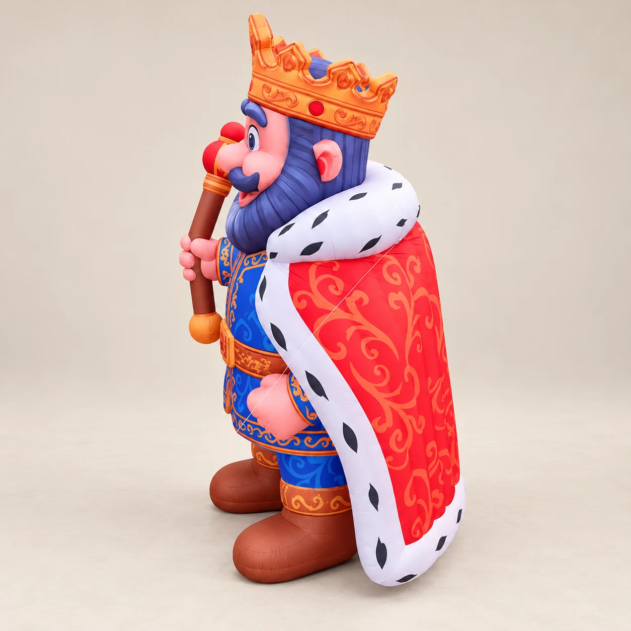 Side view of the custom inflatable king mascot and its cape silhouette