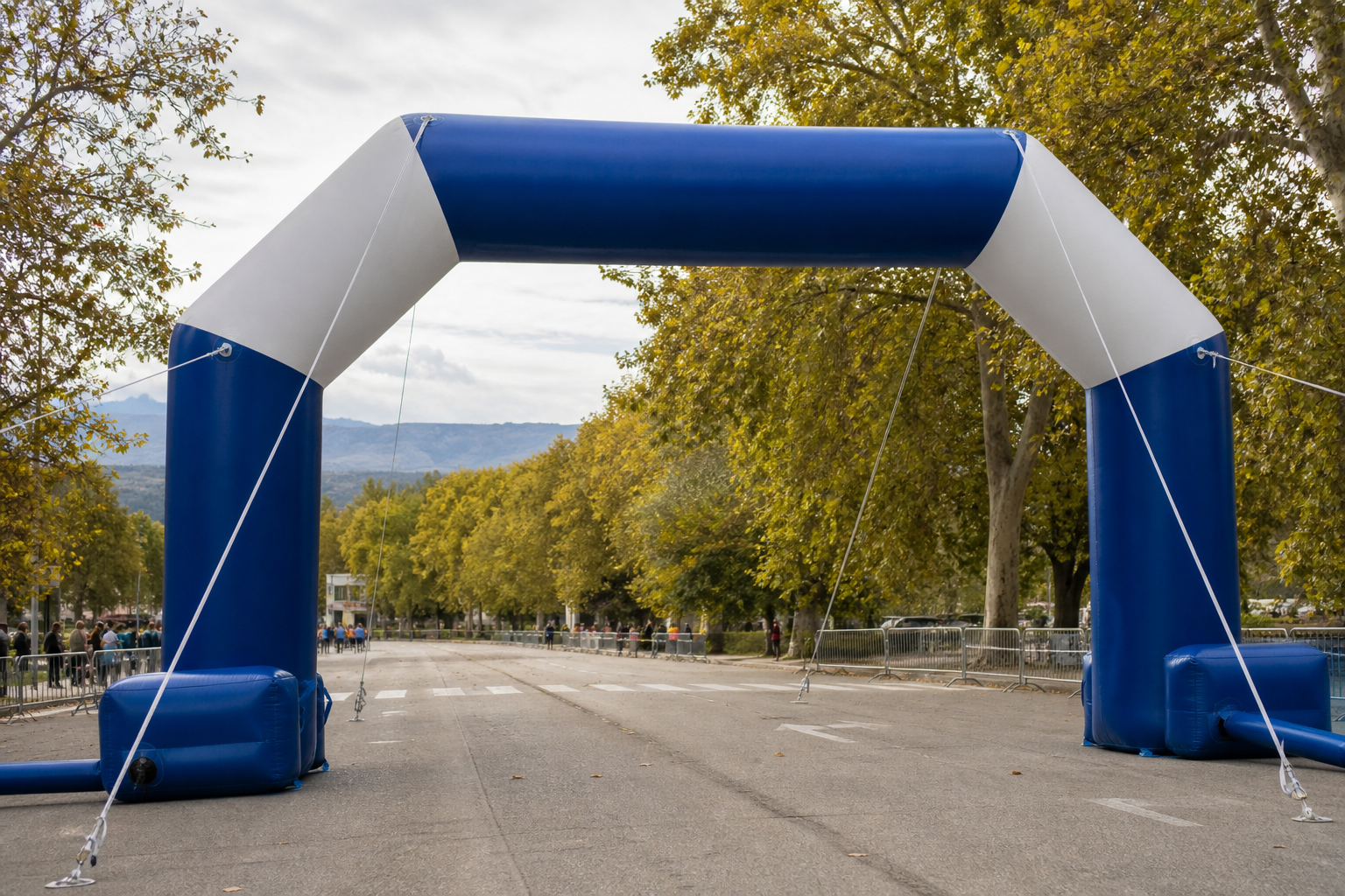 Inflatable arch marking an event entrance for comparison with a retractable banner