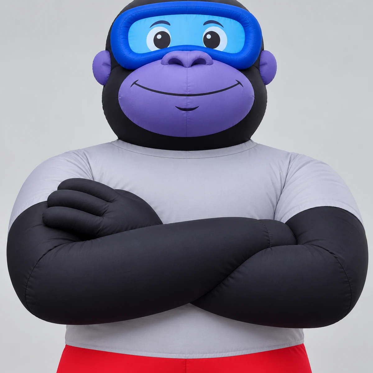 Gorilla mascot concept detail of crossed arms and gray-white short-sleeve T-shirt