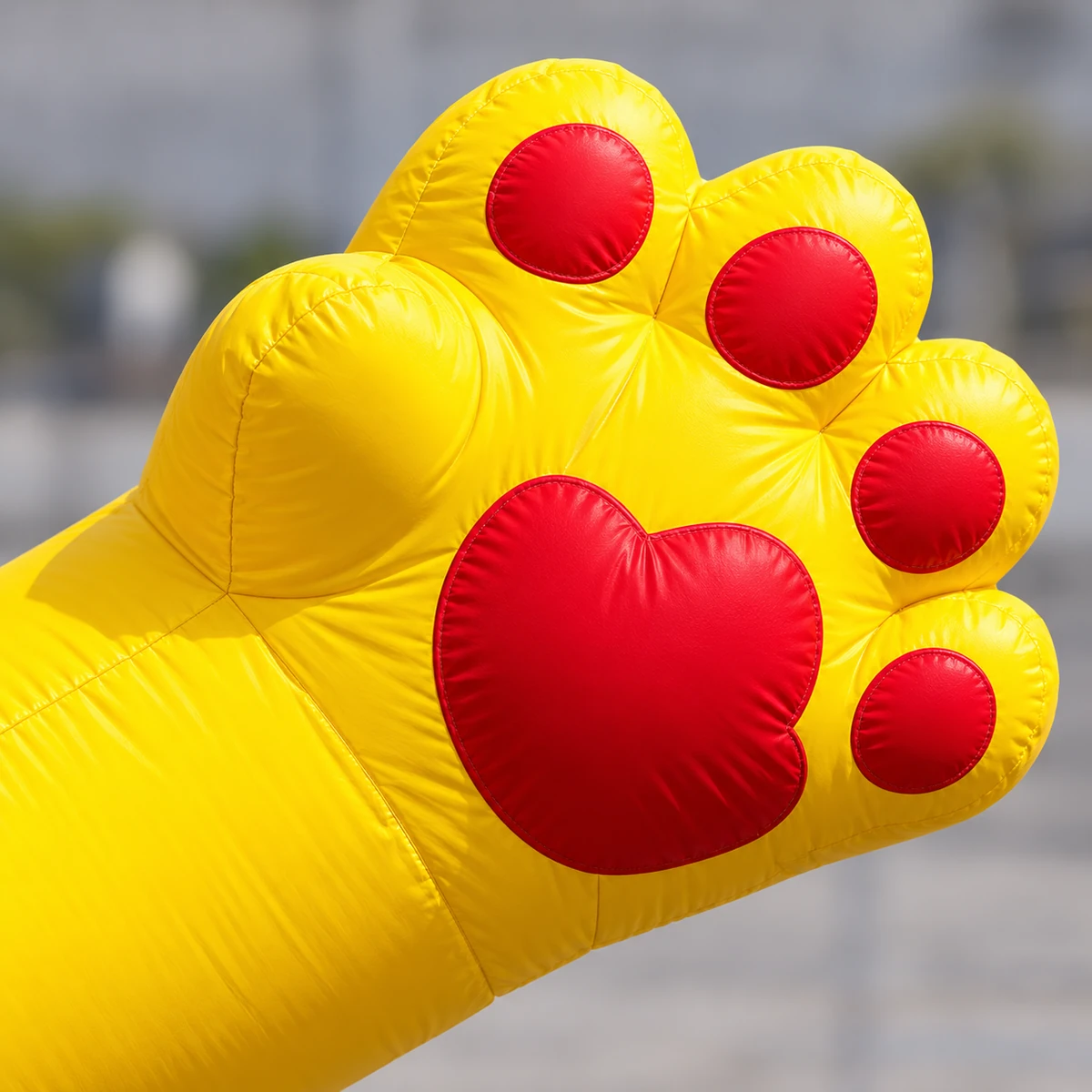 Same football tiger: close view of the yellow paw with red pads and illustrative fabric seams (AI-generated concept visualization)